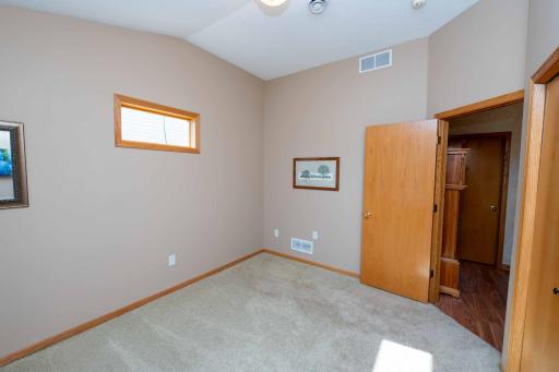 Situated near the front of the home, this versatile room can serve as an office, home gym, craft space, or secondary bedroom.