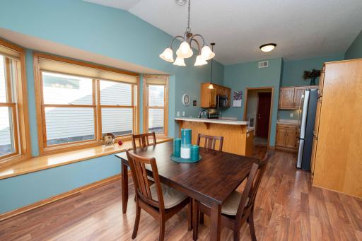 The dining area is ideal for formal meals, while the breakfast bar provides extra casual seating for quick bites.