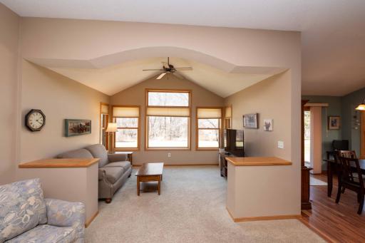 Transition into the sunroom, the perfect spot to enjoy your morning coffee and relax.