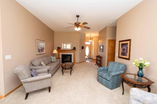 The living room is centered around a fireplace offering warmth during those cooler months.