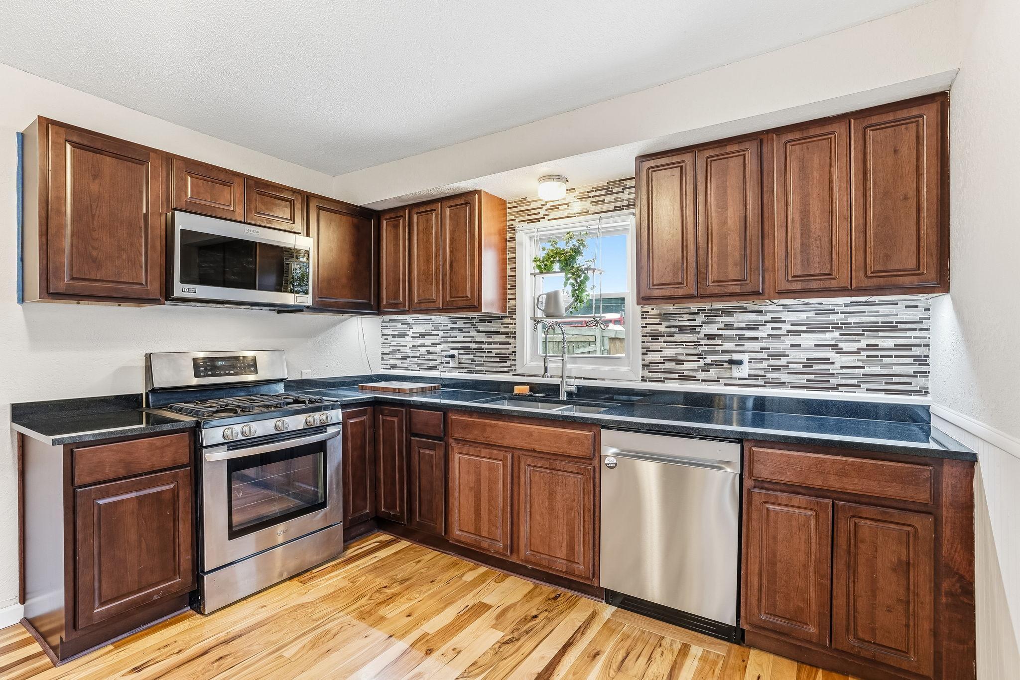 Updates you'll love! Gas range, stainless steel appliances, BRAND new dishwasher.