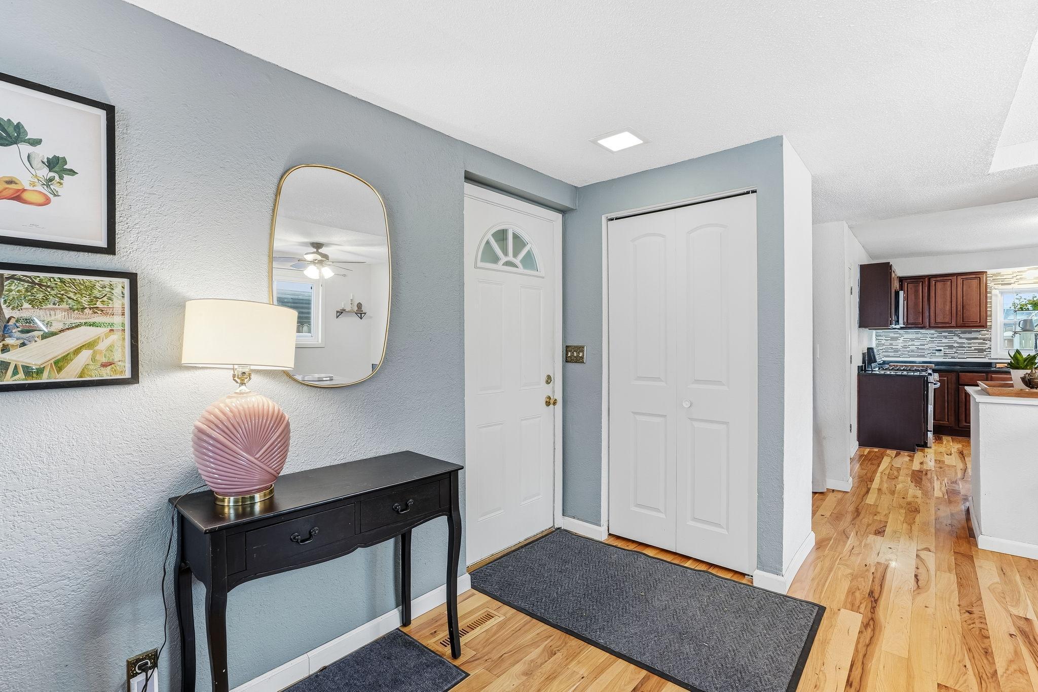 Entrance into foyer with coat closet (side door).