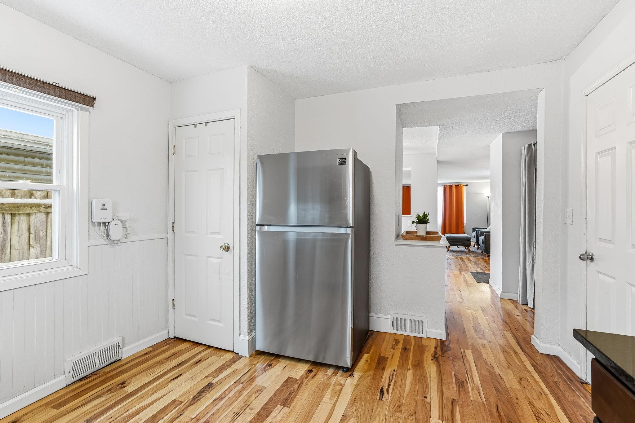 Door to basement next to refrig.