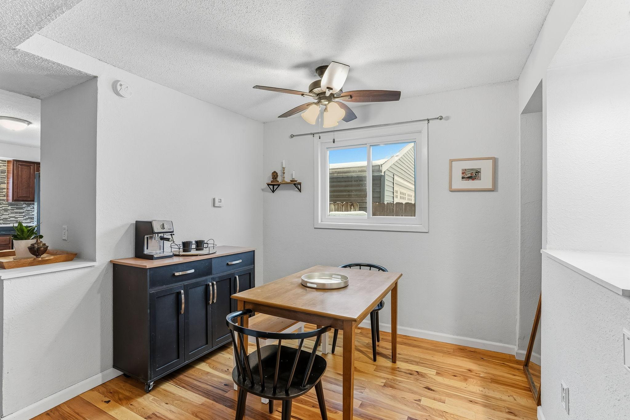 Dining has ceiling fan and coffee bar area