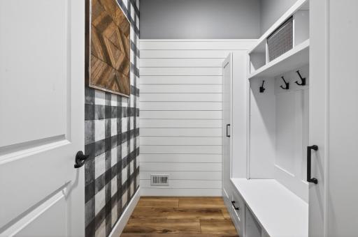 Amazing closet with cubbies off the garage entrance for storing coats, backpacks, shoes, etc