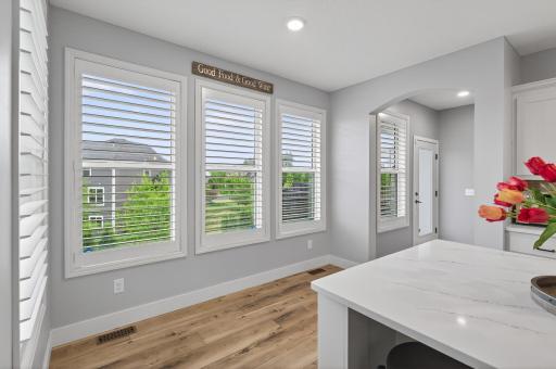 This area leads to the walk-in pantry, access to the back deck and built in hutch with beverage cooler