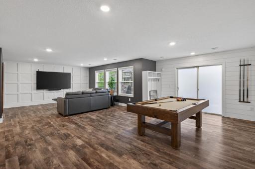 This fantastic space walks out to the covered patio and pool area