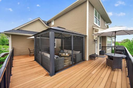 Walk out to your maintenance free deck overlooking a great backyard oasis