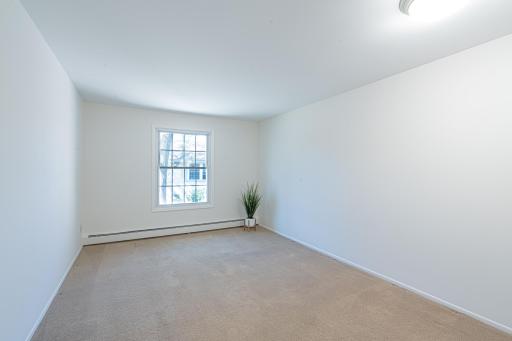 4548 Cedar Lake Rd S _ Spacious bedroom with natural light and neutral finishes.