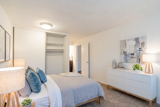 4548 Cedar Lake Rd S _ Functional layout and large closet within the bedroom. (virtual staging)