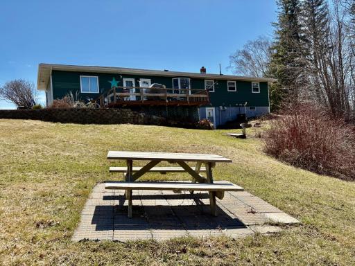 Back of home with walk out basement/Picnic area