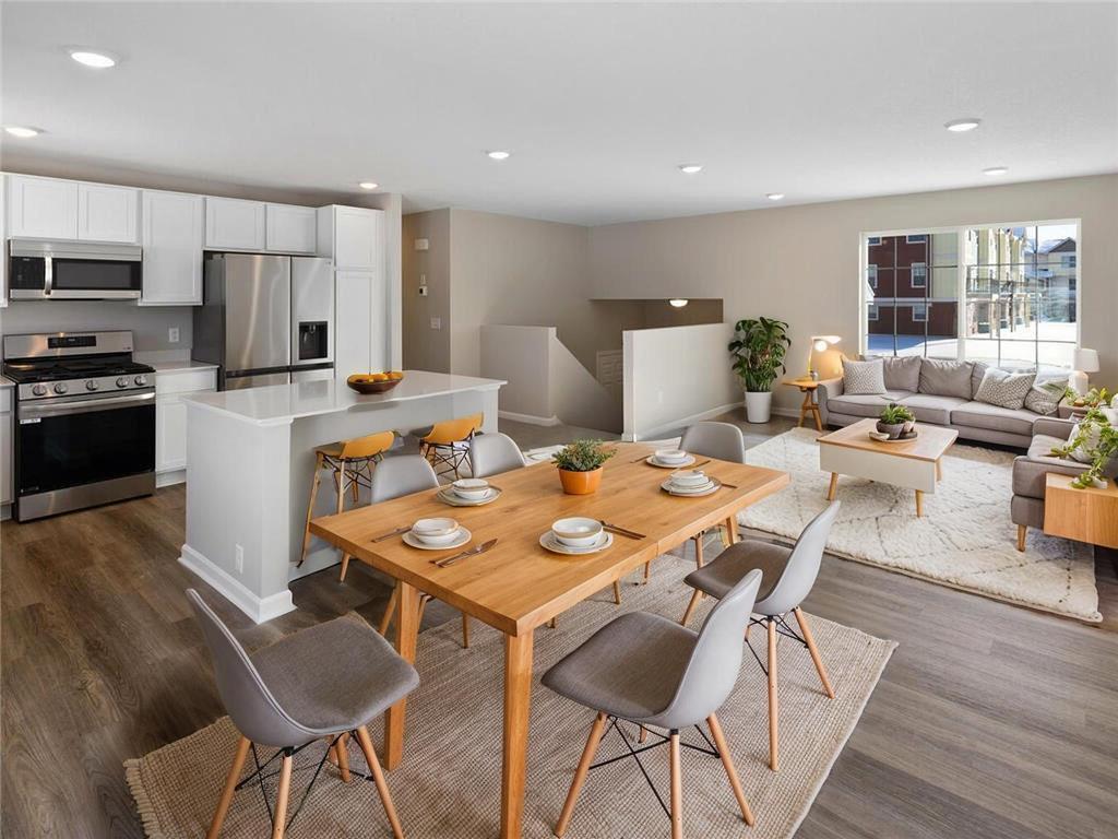 Open Layout, Virtually Staged. Photo taken of another home with similar plan and finishes. Photos and renderings may not depict actual plan, materials, & finishes may vary. All measurements are approximate.