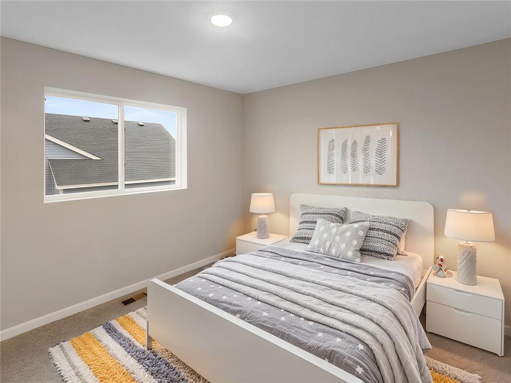 Bedroom 2, Virtually Staged. Photo taken of another home with similar plan and finishes. Photos and renderings may not depict actual plan, materials, & finishes may vary. All measurements are approximate.