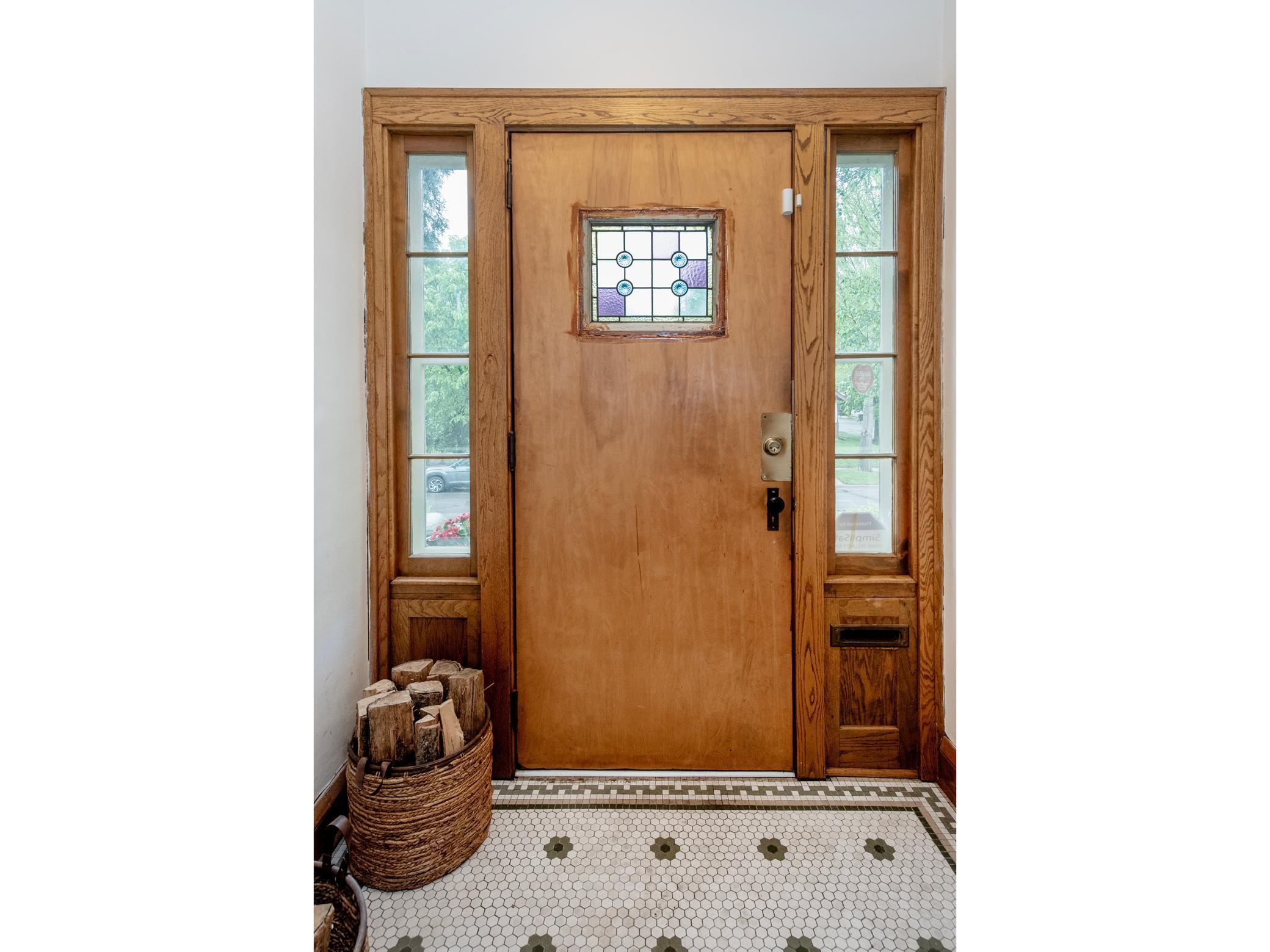 Charming front entryway with classic tile flooring.