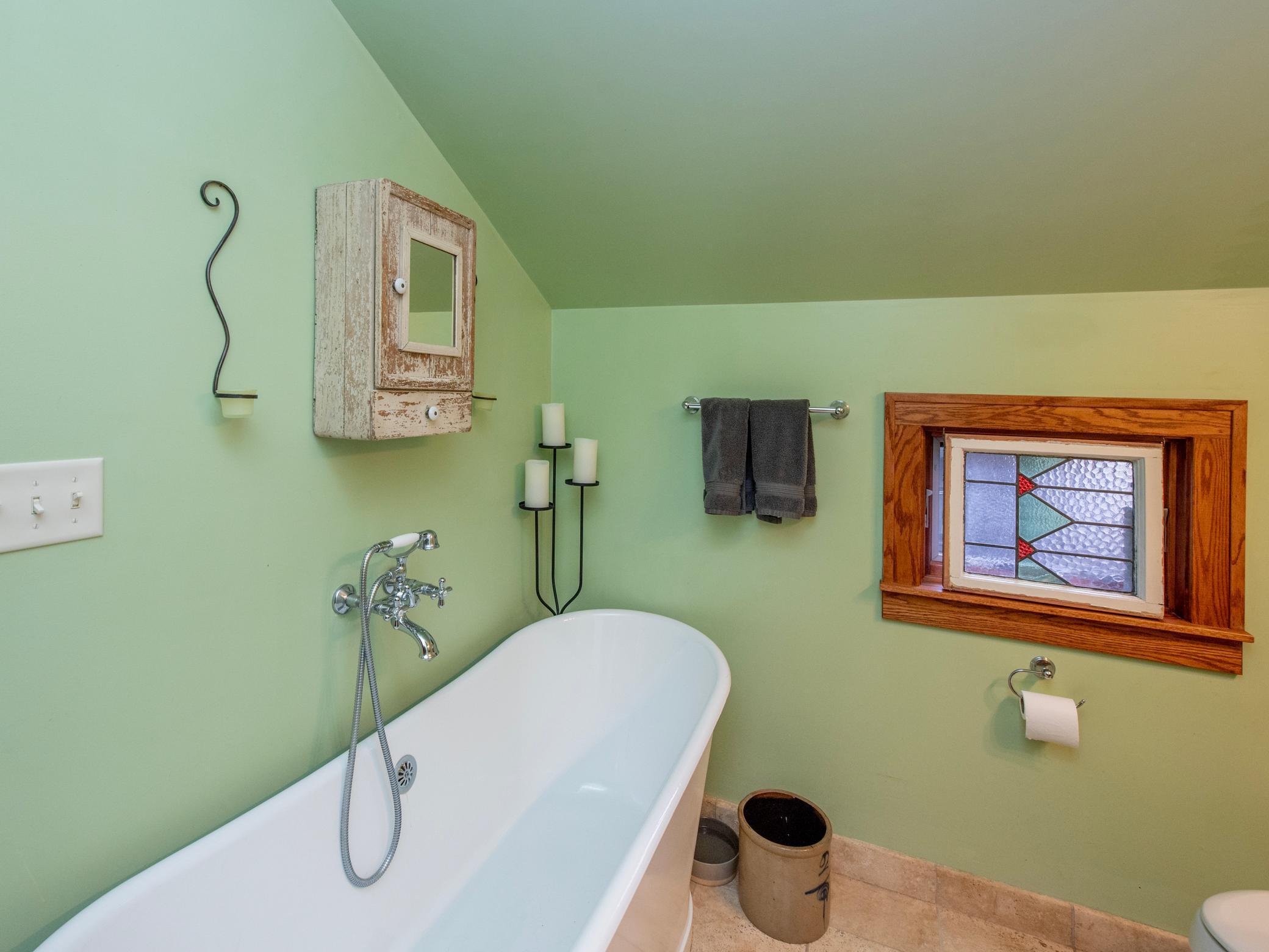Full primary ensuite with soaking tub, tile flooring and 3/4 shower.