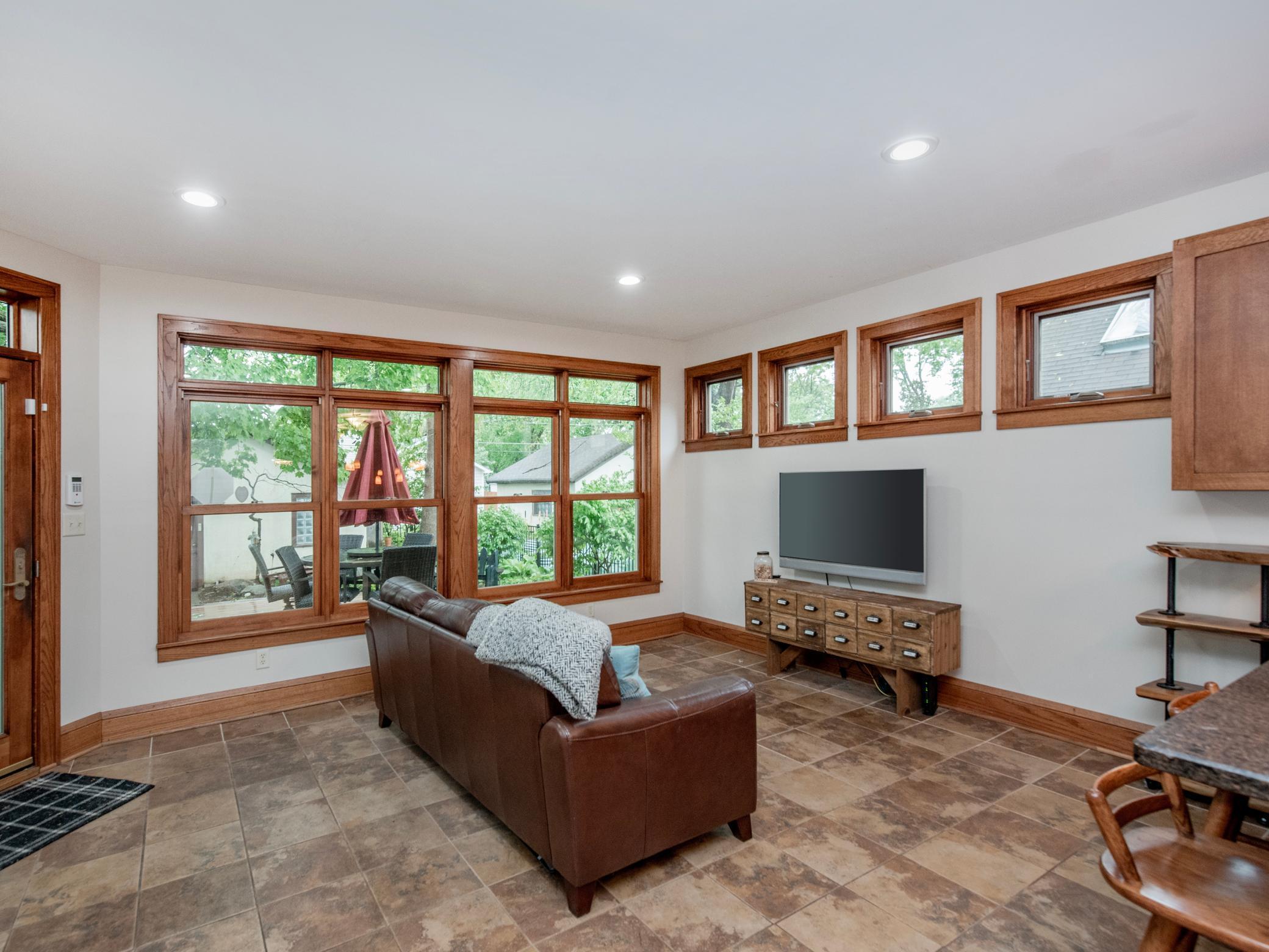 Expansive windows flood the space with abundant natural light.