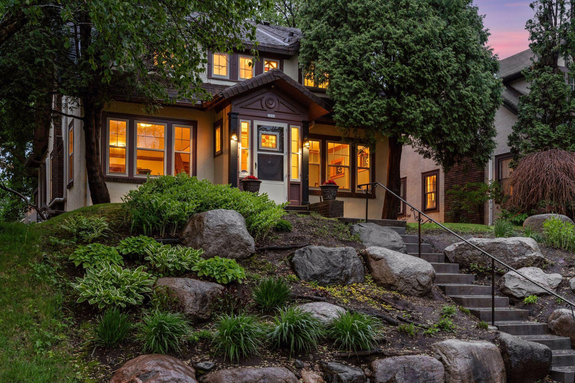 Exceptional curb appeal enhanced by professional landscaping.