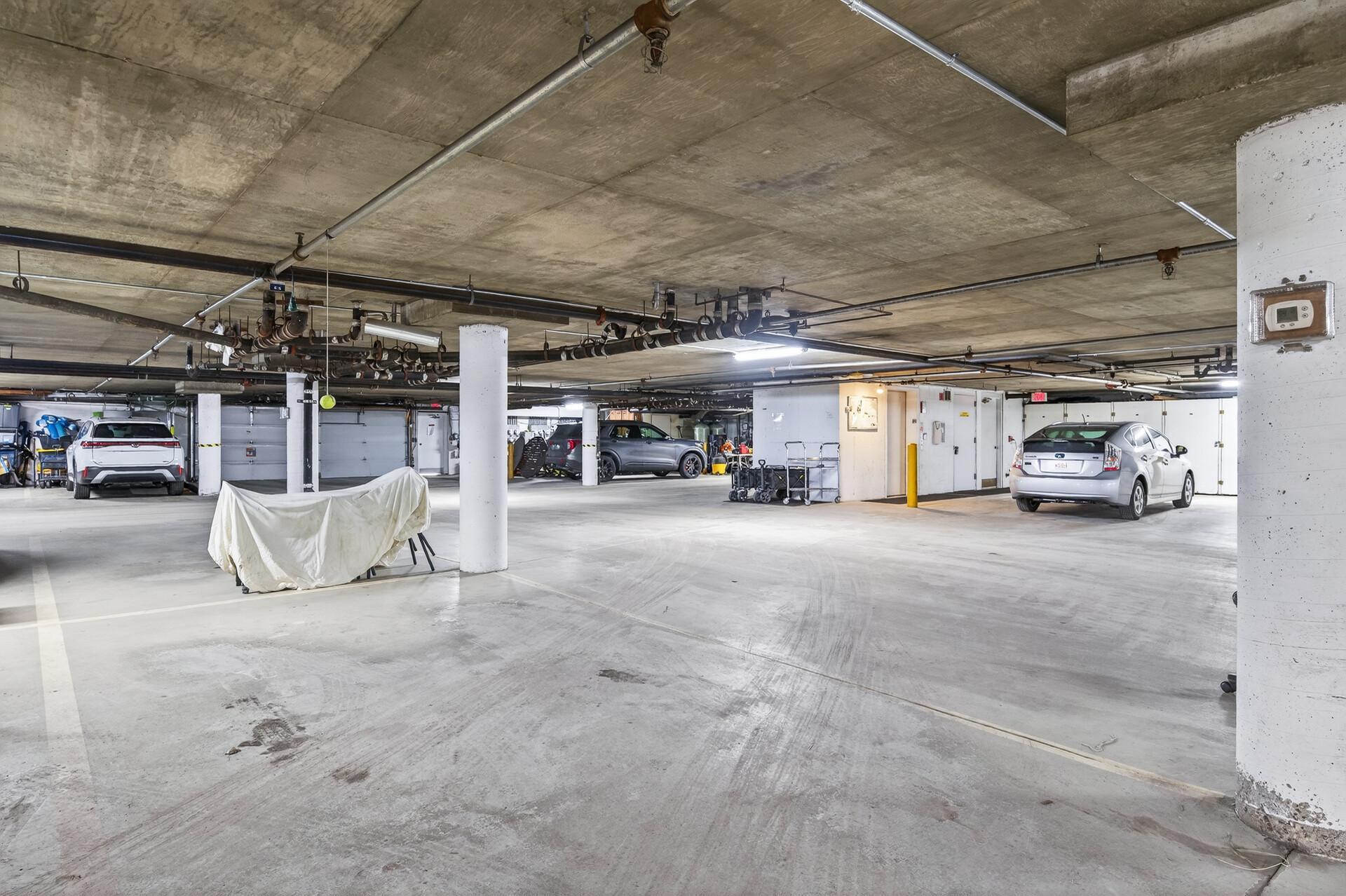 Two side by side parking spots near elevator.