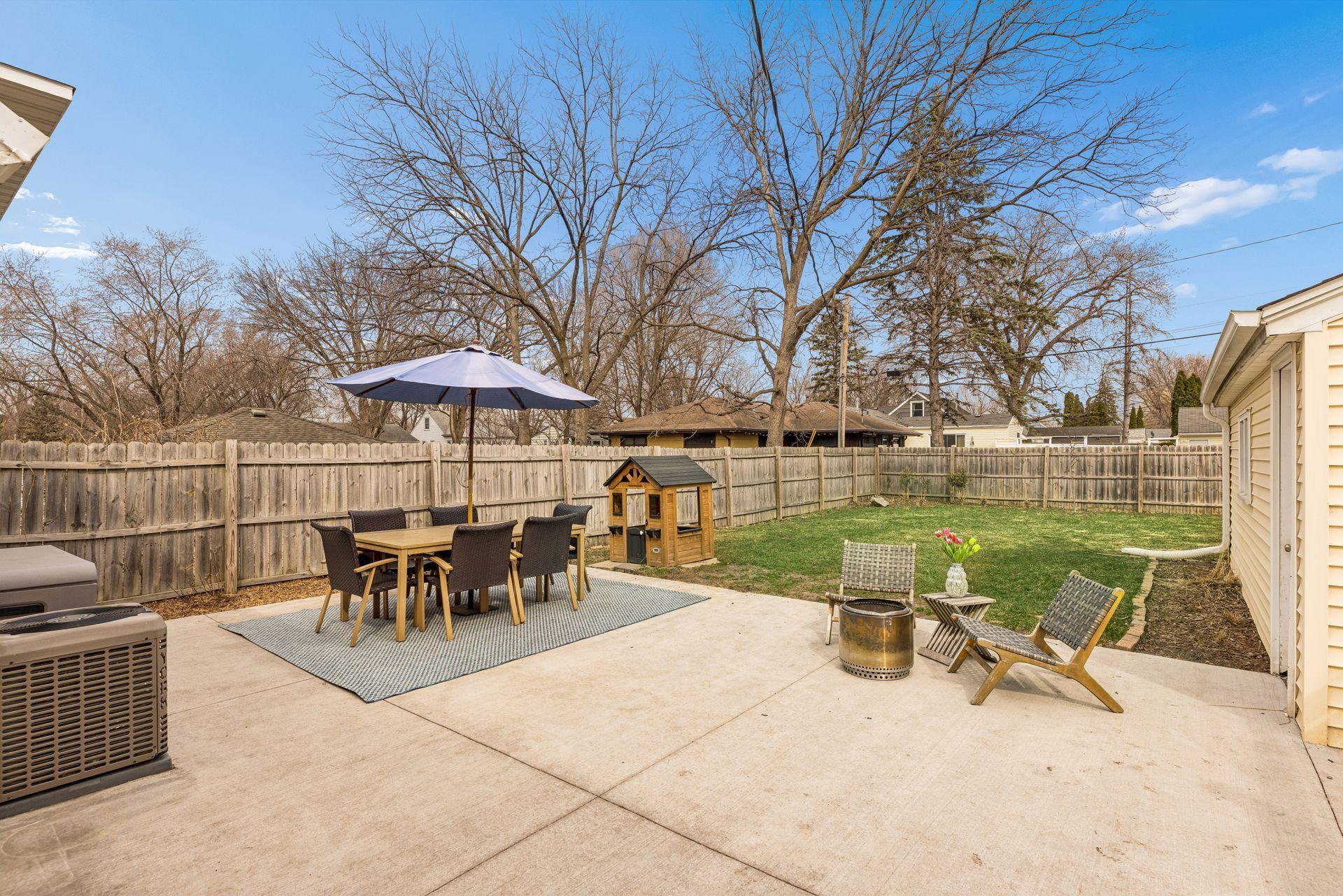 Private fenced backyard w new concrete