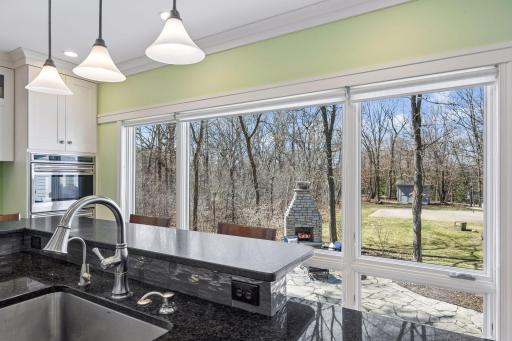 Wash your dishes with a view to the backyard. Views from all angles.