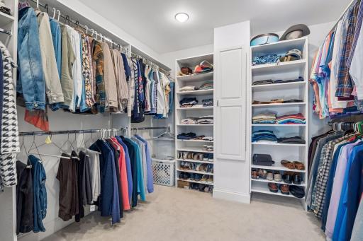 Large custom primary closet with convenient built ins. Plenty of space!