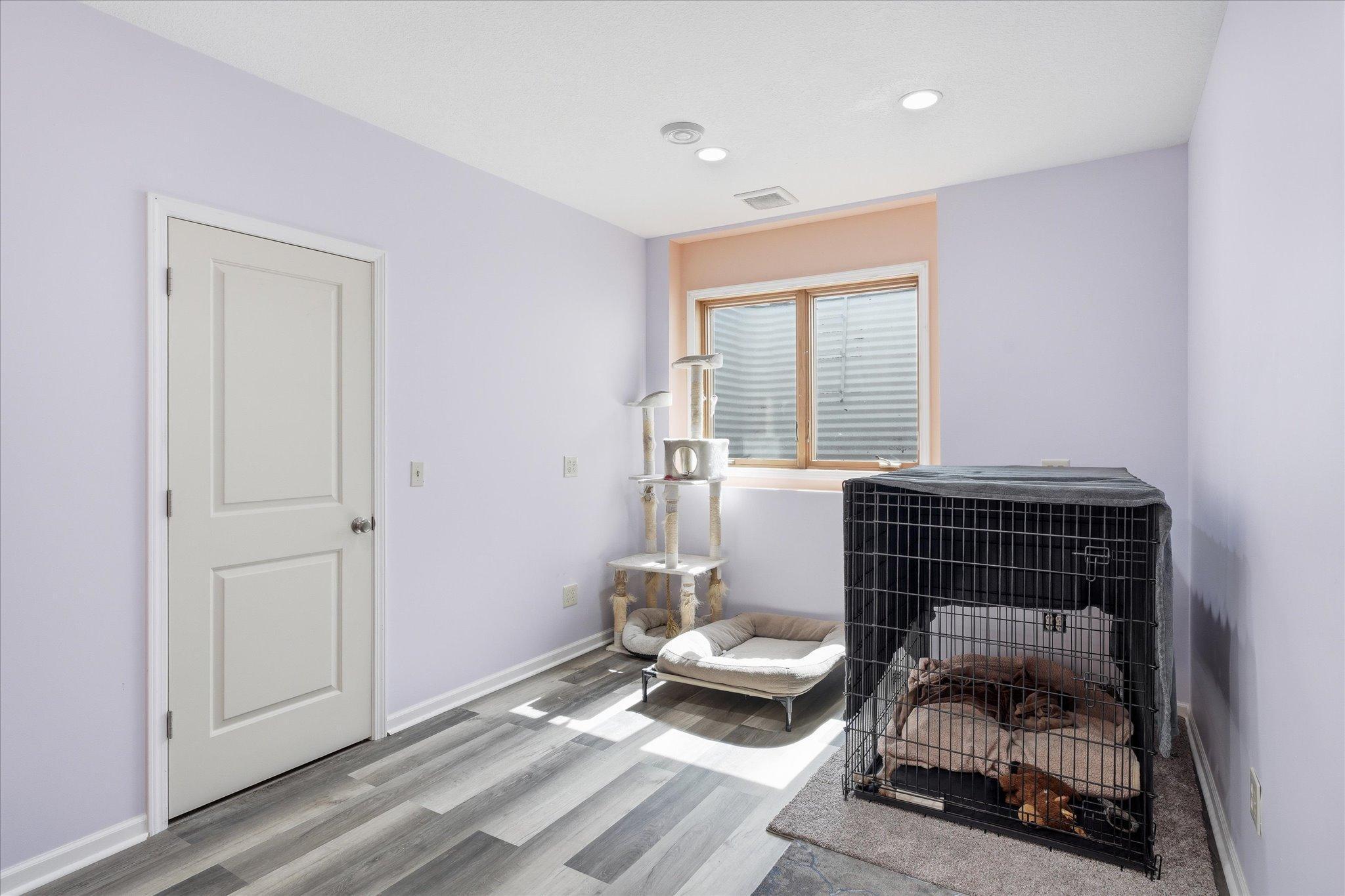 The fourth bedroom is in the lower level and has a HUGE closet. Space was previously used for an in-home business and has separate ventilation and electric system.