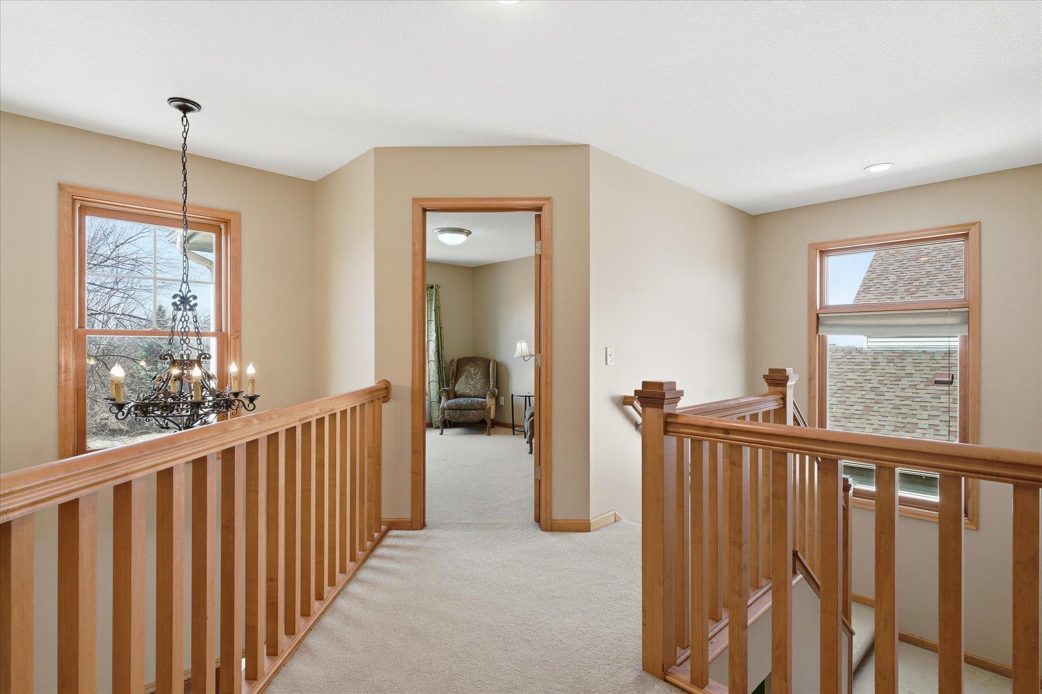 The cat-walk hallway in the upper level continues the open layout feeling.