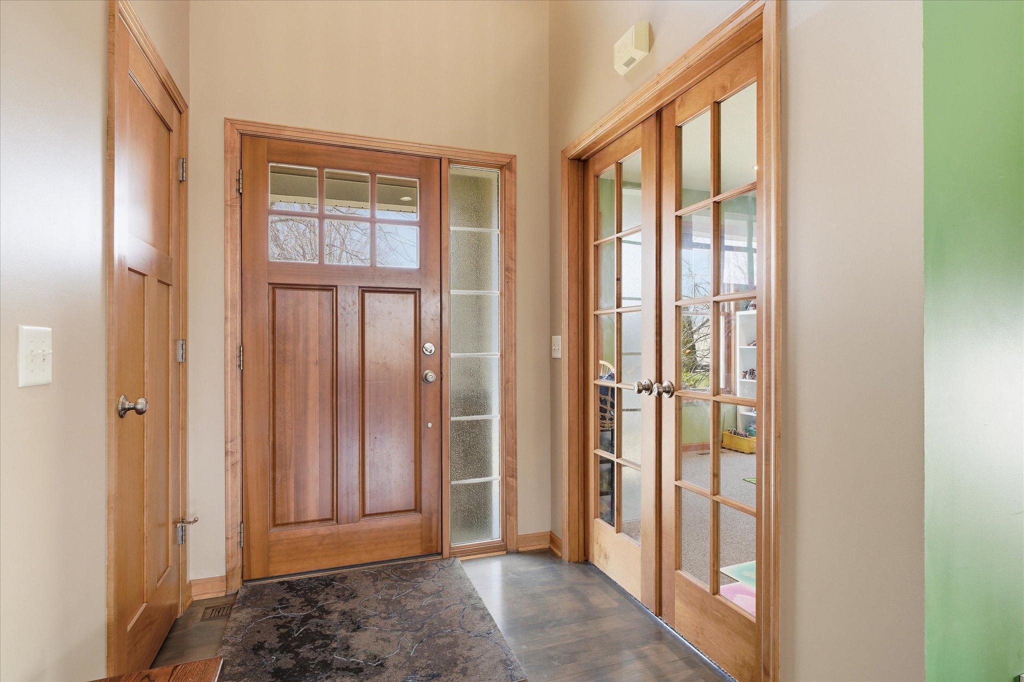 Entry way with French doors going into office space, formal dining, or play room as currently used. :)