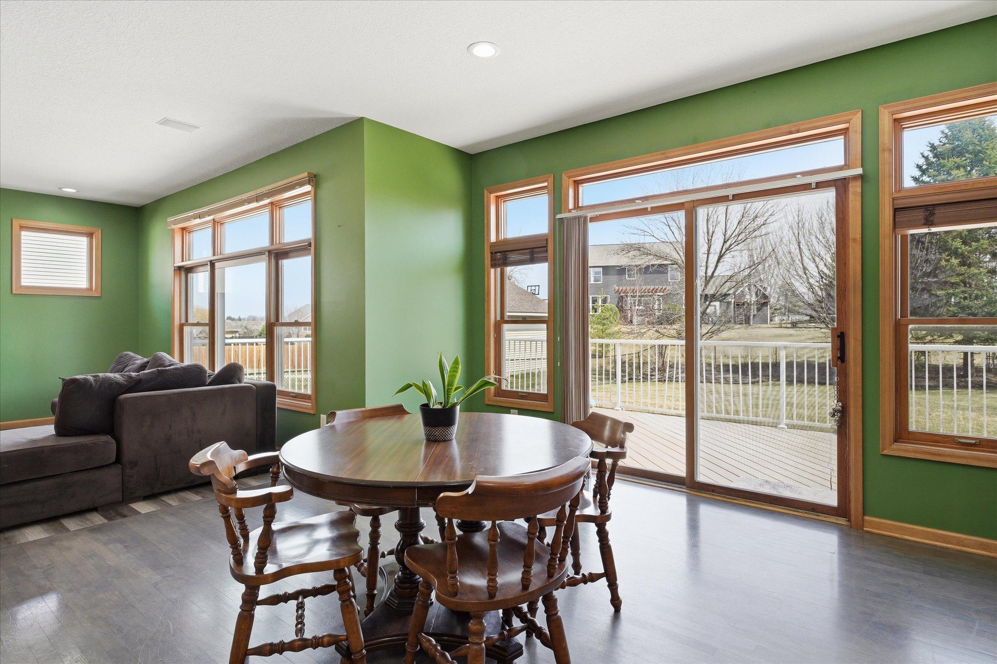 Informal dining walks out to maintenance-free deck which extends the length of home.