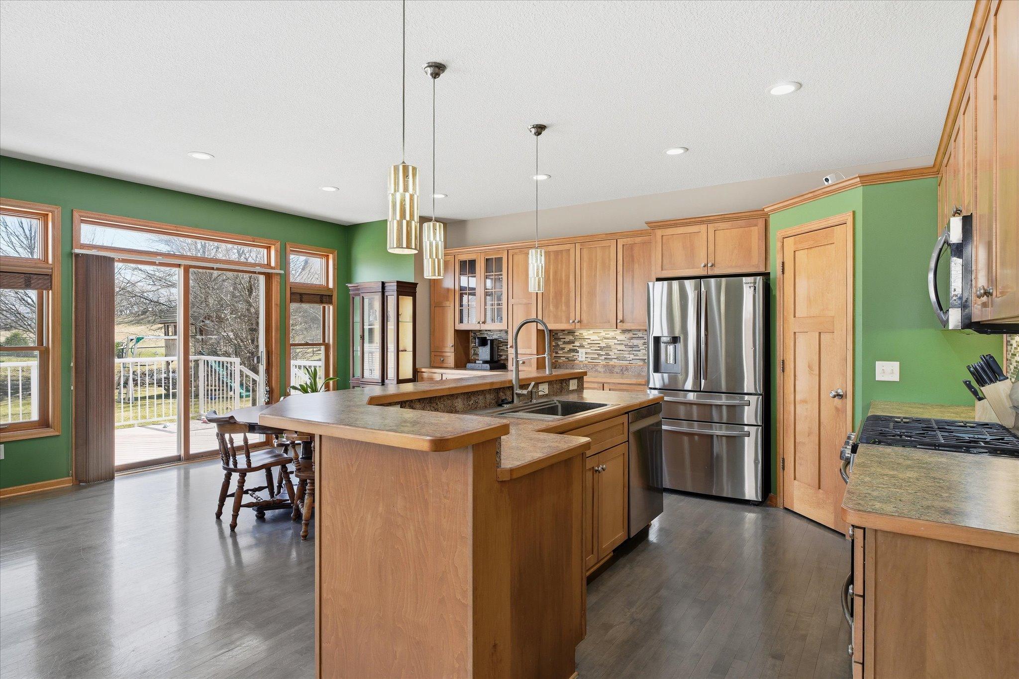 Look at this open Kitchen and dining space with countertops and cabinet space galore!