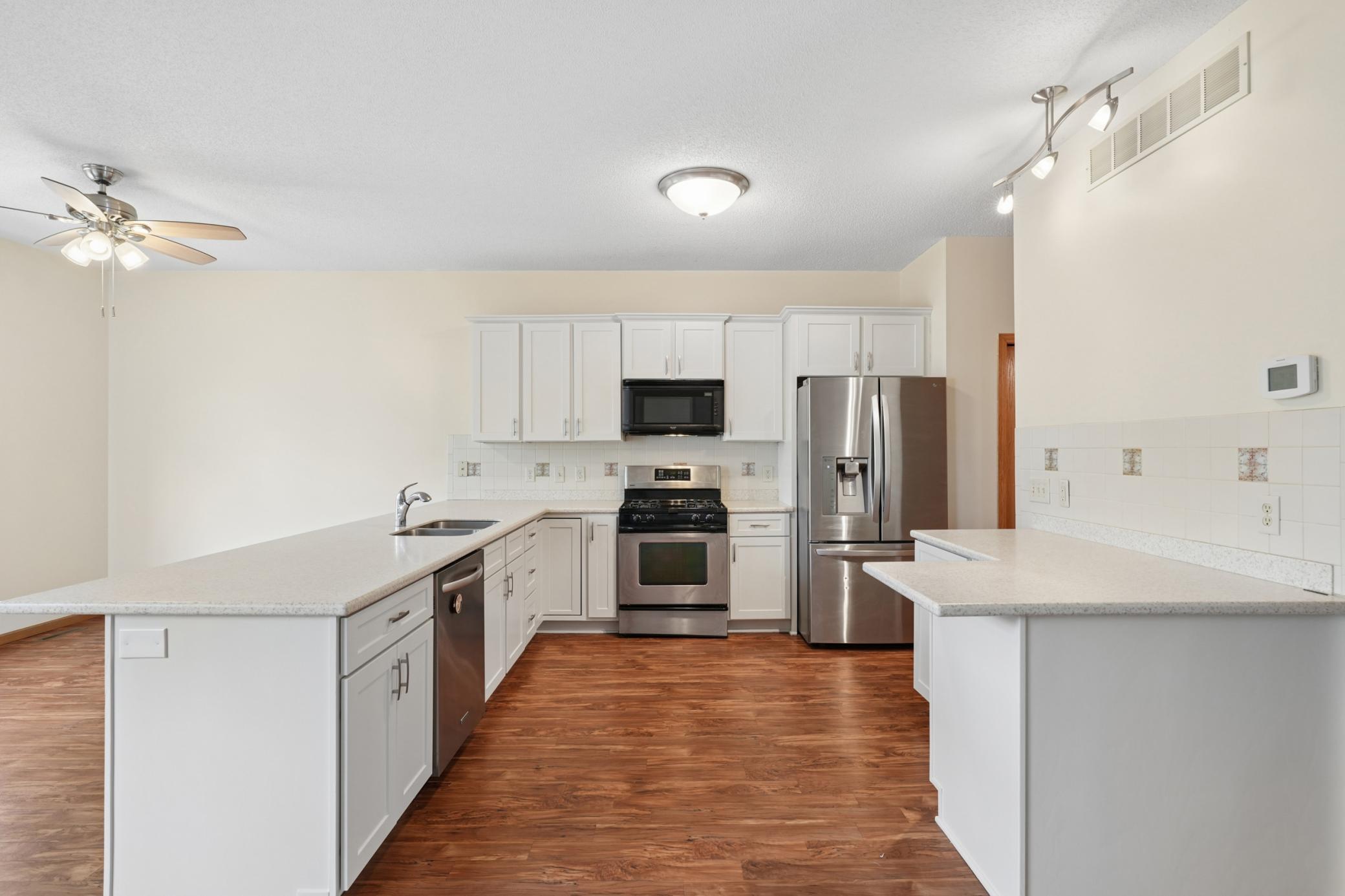 Open concept Main Level living with updated kitchen and views of the pond