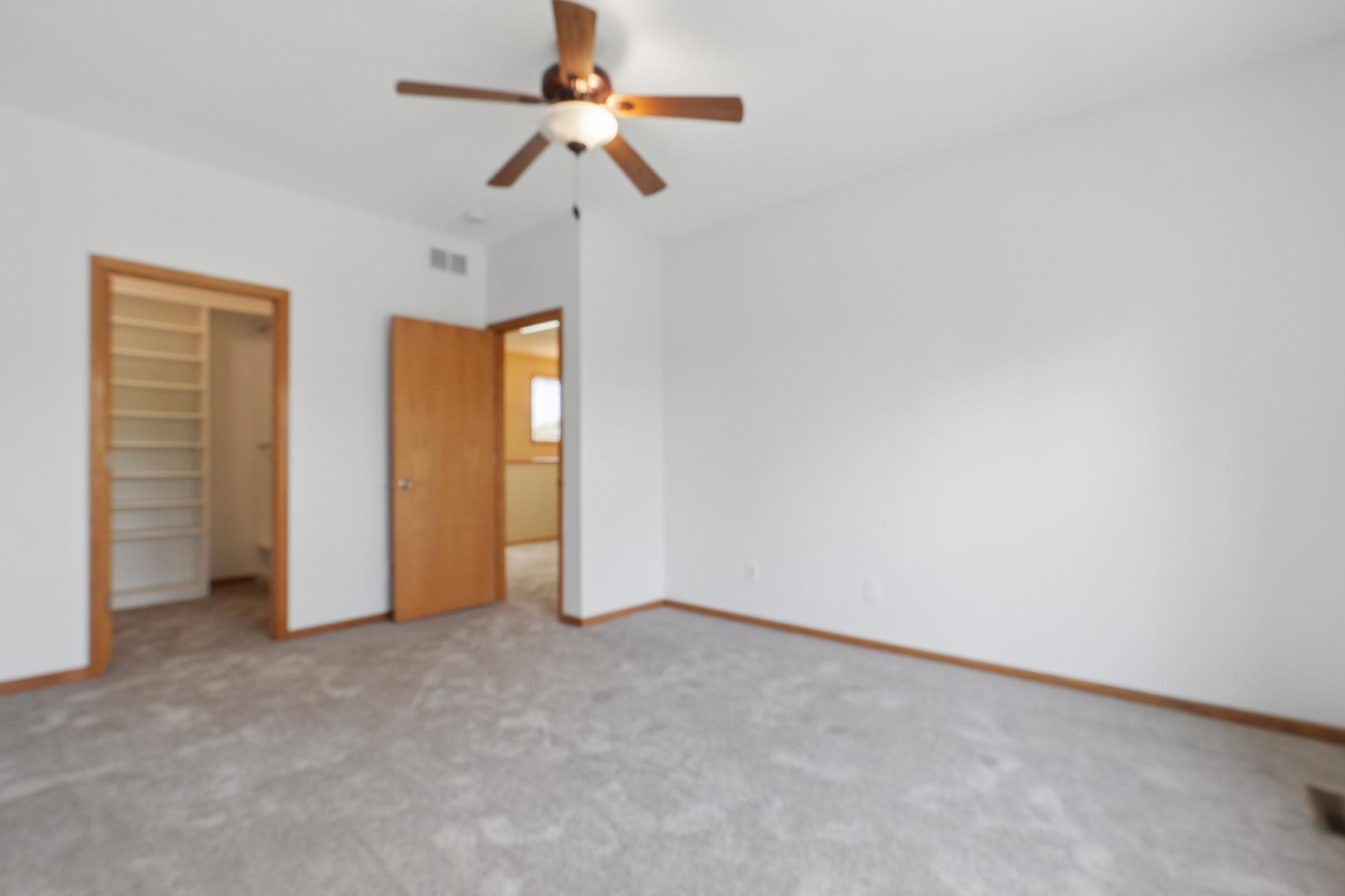 Primary Bedroom on Upper Level with views of the pond