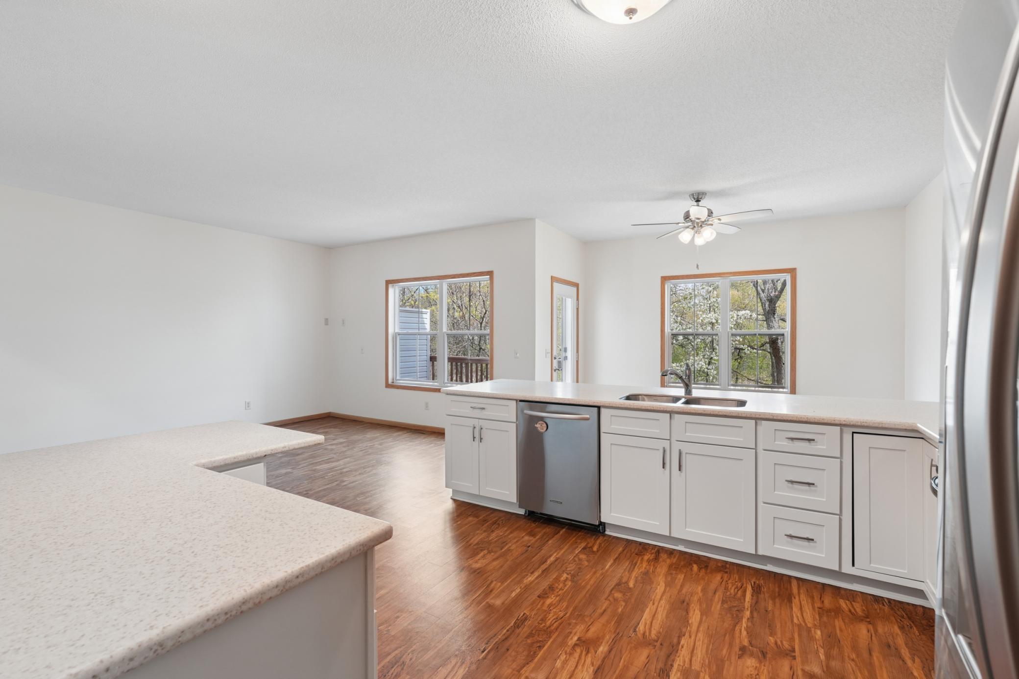 Open concept Main Level living with updated kitchen and views of the pond