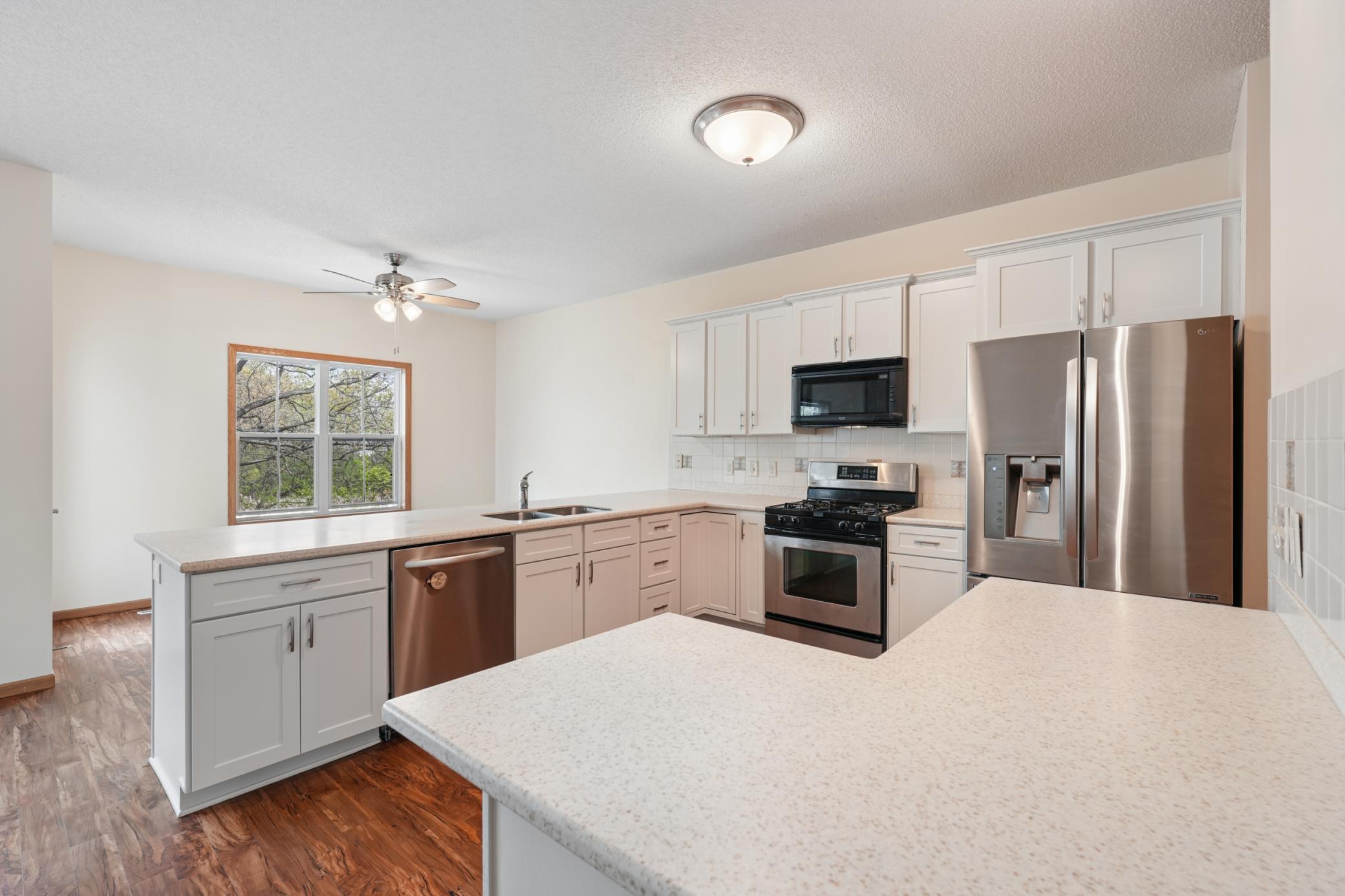 Open concept Main Level living with updated kitchen and views of the pond