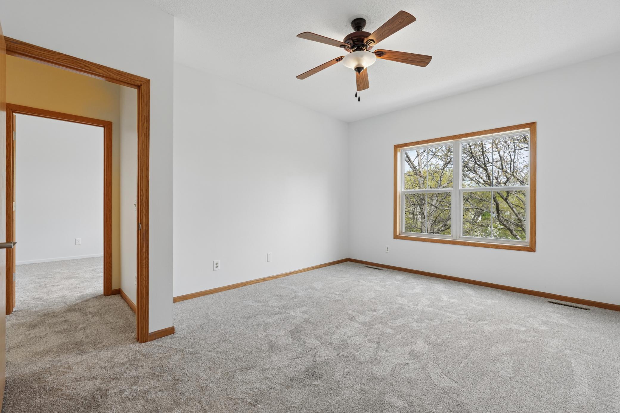 Primary Bedroom on Upper Level with views of the pond