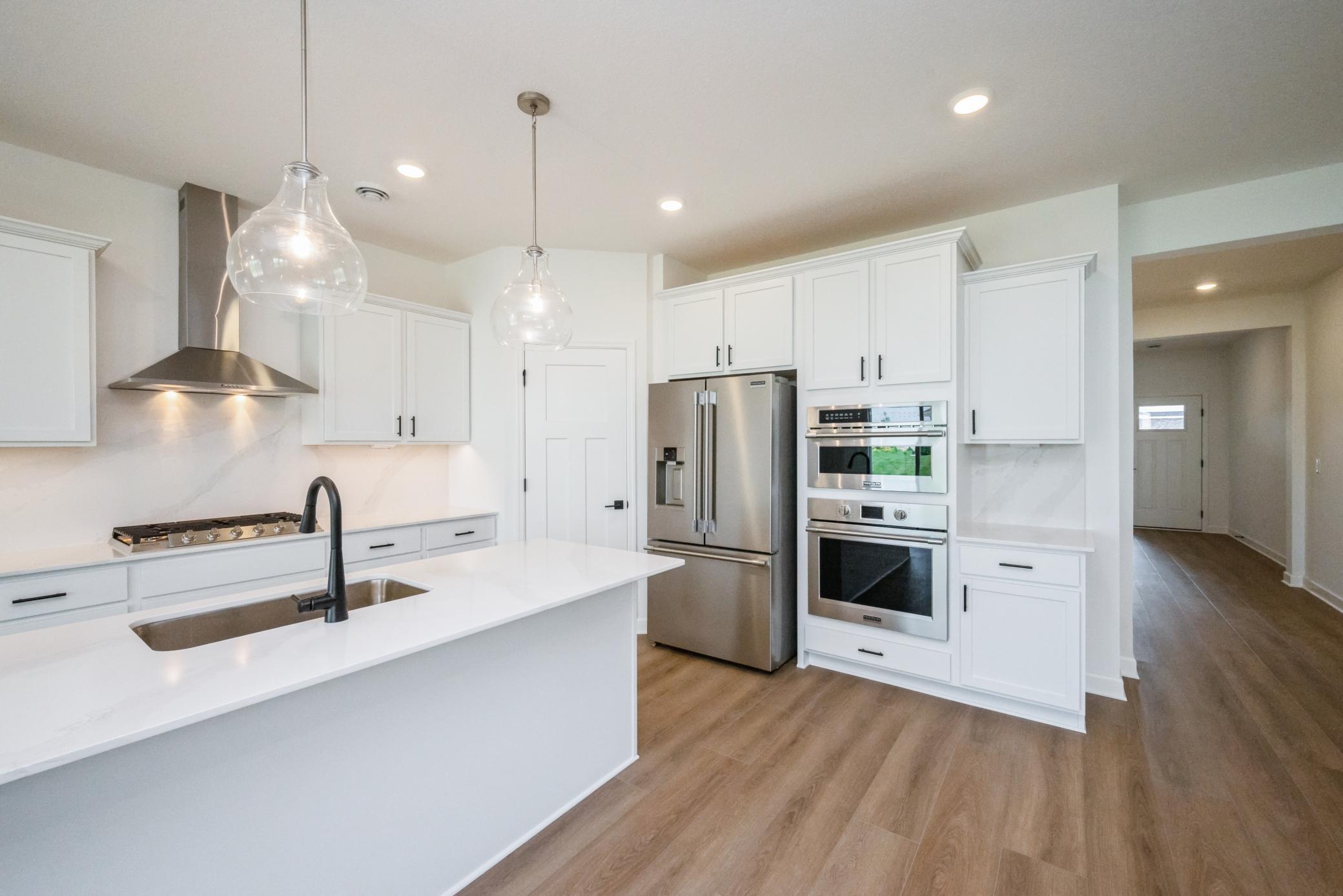 (Photo of a decorated model, actual homes finishes will vary) Welcome to the Salerno! The beautiful gourmet kitchen has a lot to offer.