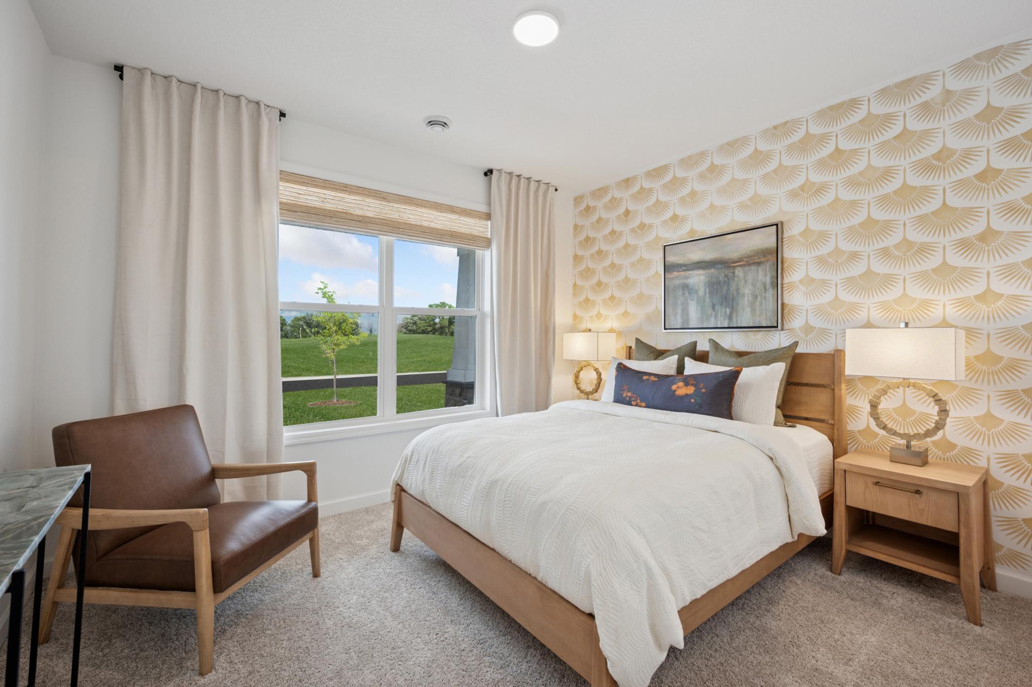 (Photo of a decorated model, actual homes finishes will vary) One of two secondary bedrooms!