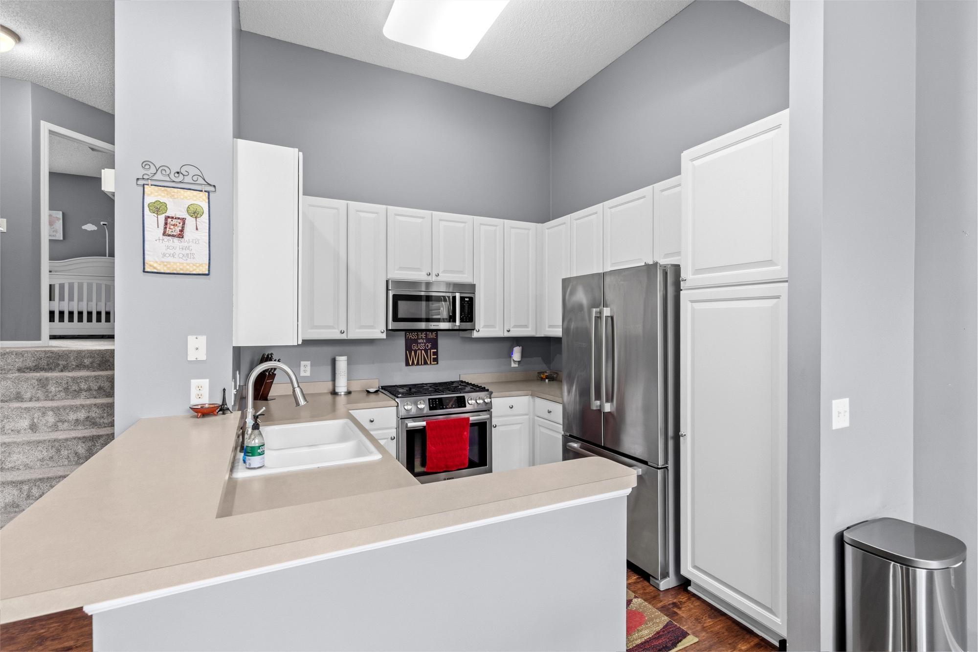 Stainless steel appliances in the kitchen.