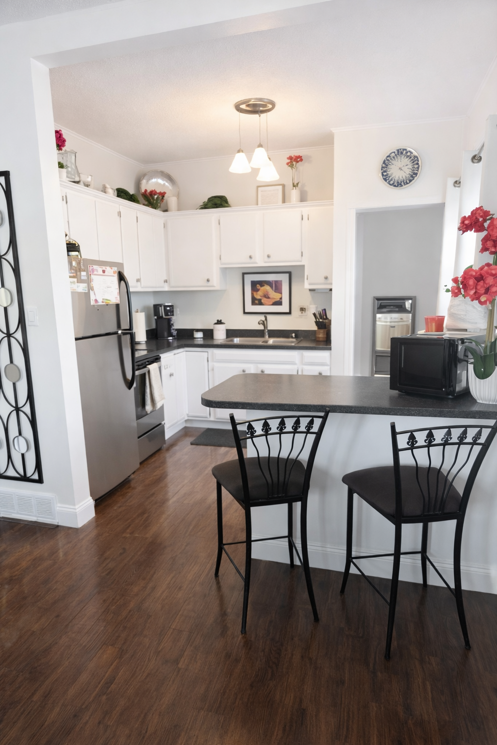 Bright kitchen with wrought iron accents.png