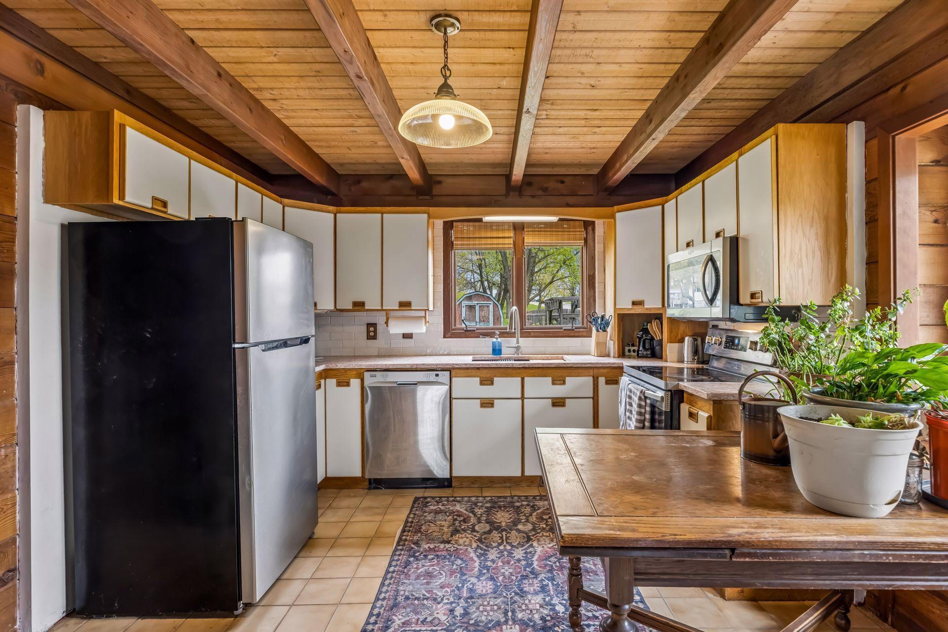 The eat-in kitchen features new limited edition quartz counters, white zellige tile backsplash, workstation sink in 2026. Plus new dishwasher and garbage disposal in 2024.