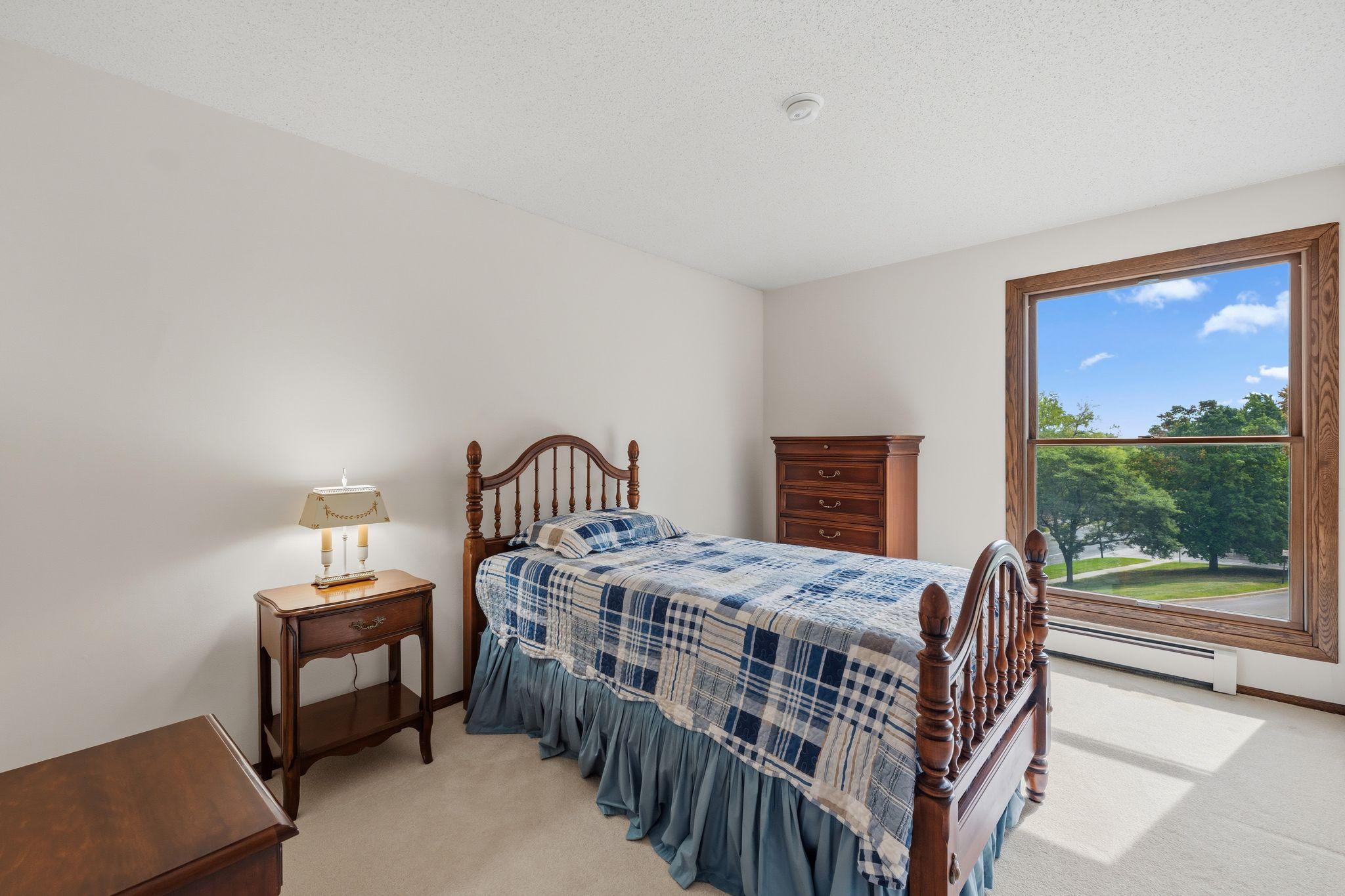 The 2nd bathroom features a large window