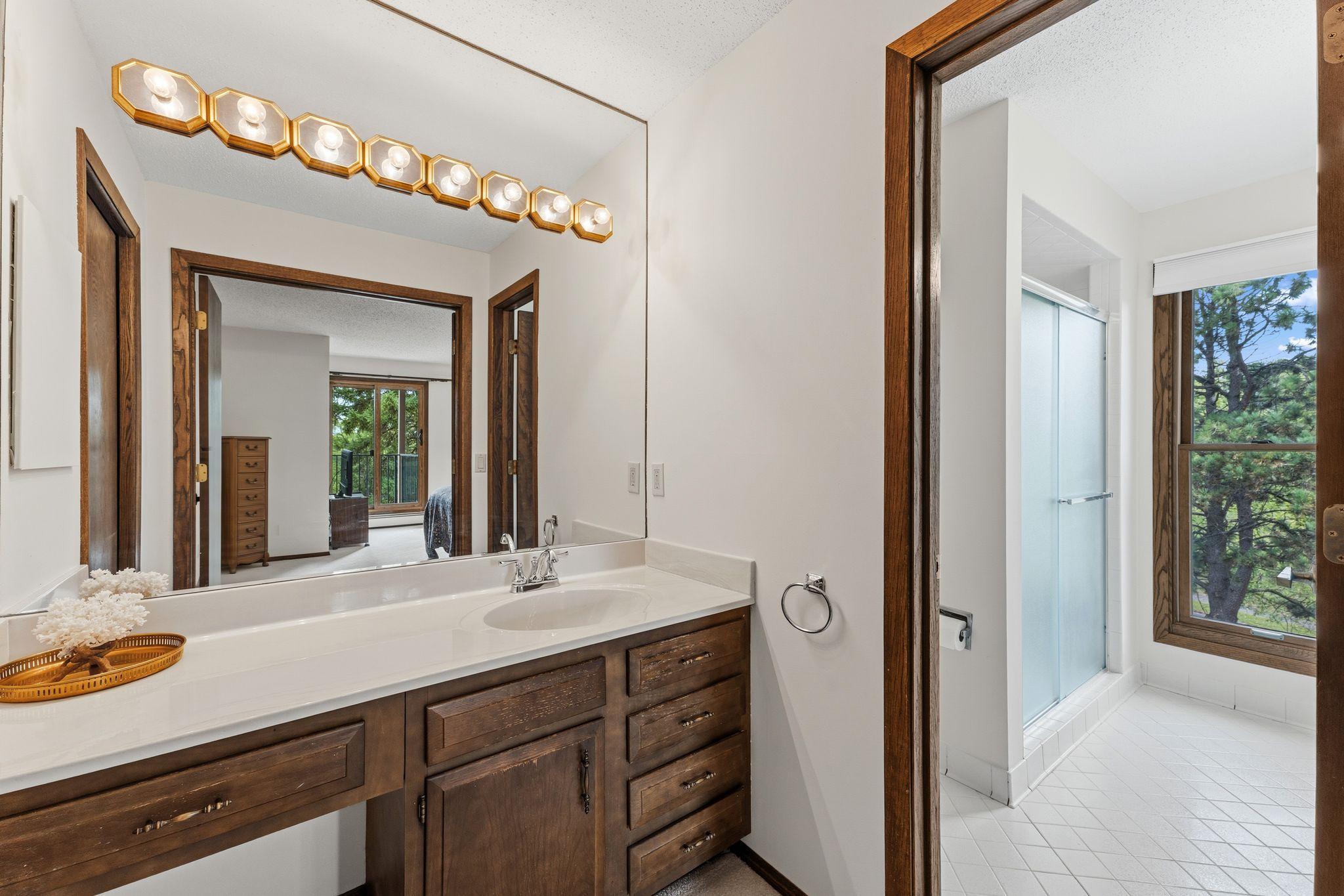 The primary bath features a separate vanity area
