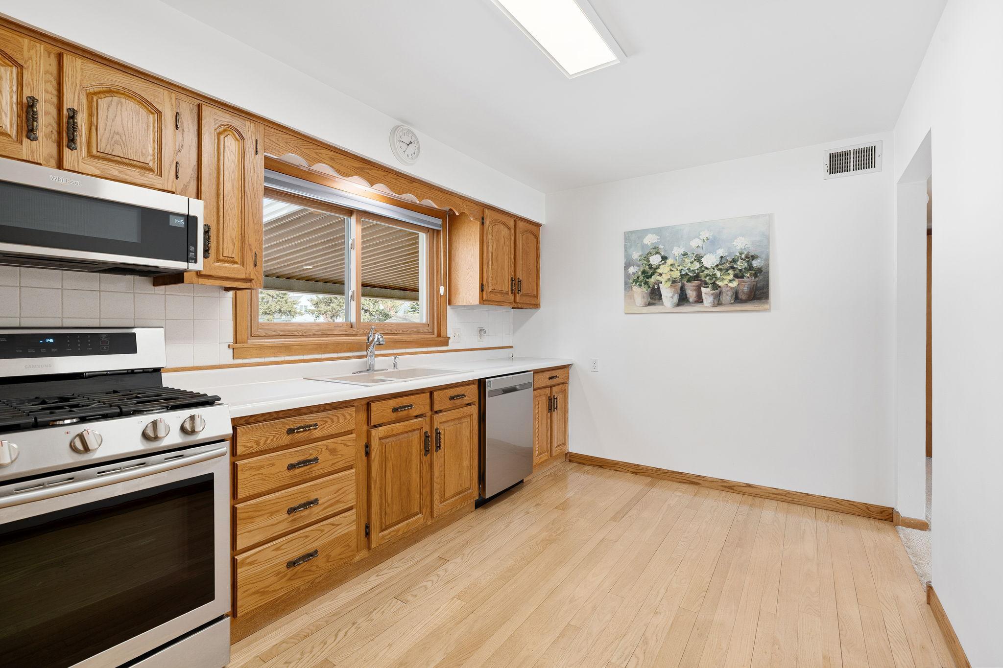 Hardwood Floors in the kitchen and assumed to be under Carpet.