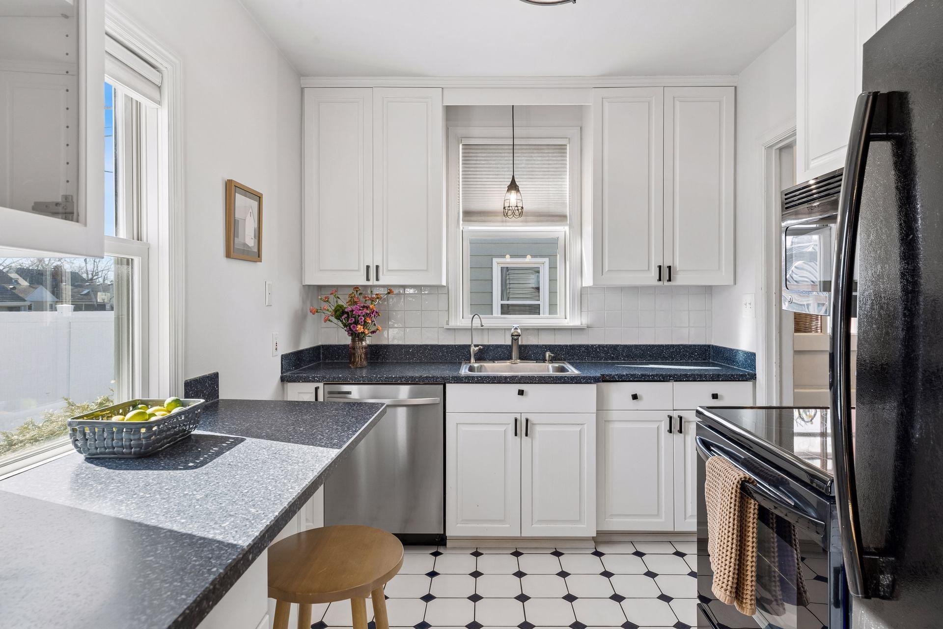Modernized kitchen with plentiful cabinets, too!