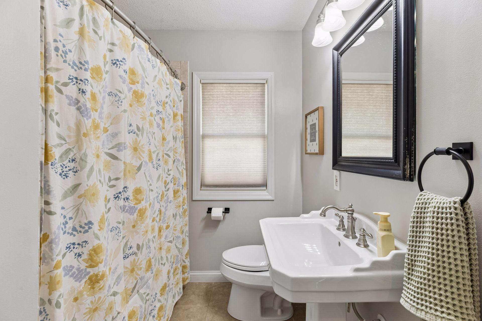 Full bath with modernized finishes complete with newer toilet.