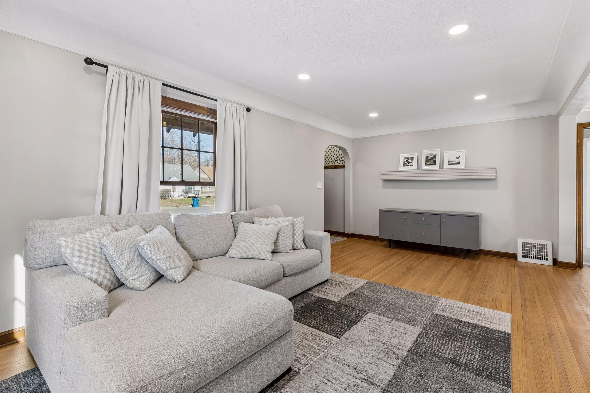 Coved ceilings, timeless hardwood floors & added recessed lighting!