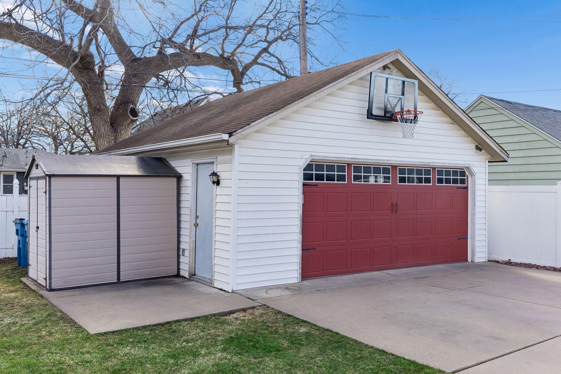 Spacious 2 stall garage & storage shed!