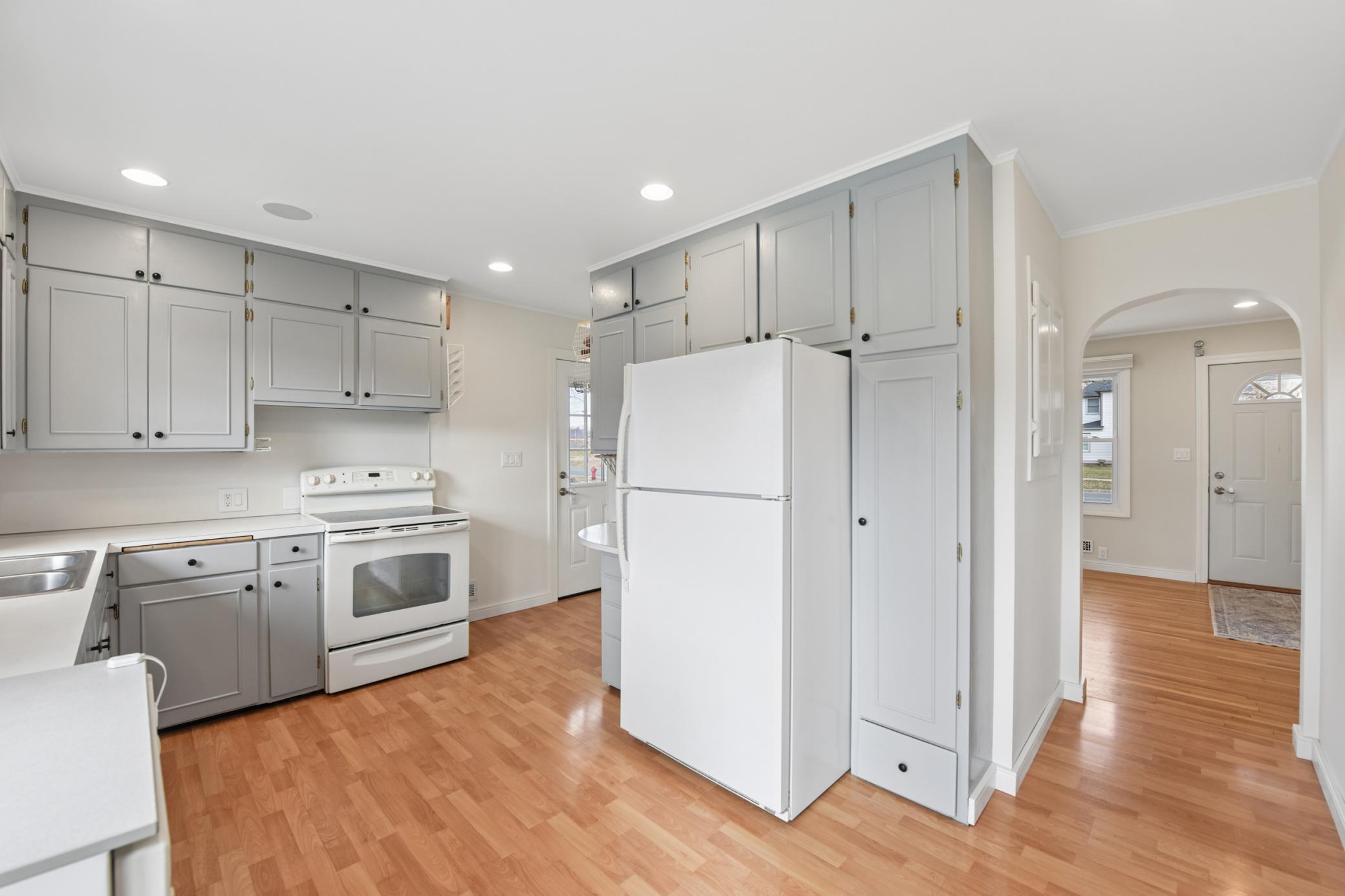 Ample cabinet space and a handy side entrance to the kitchen.