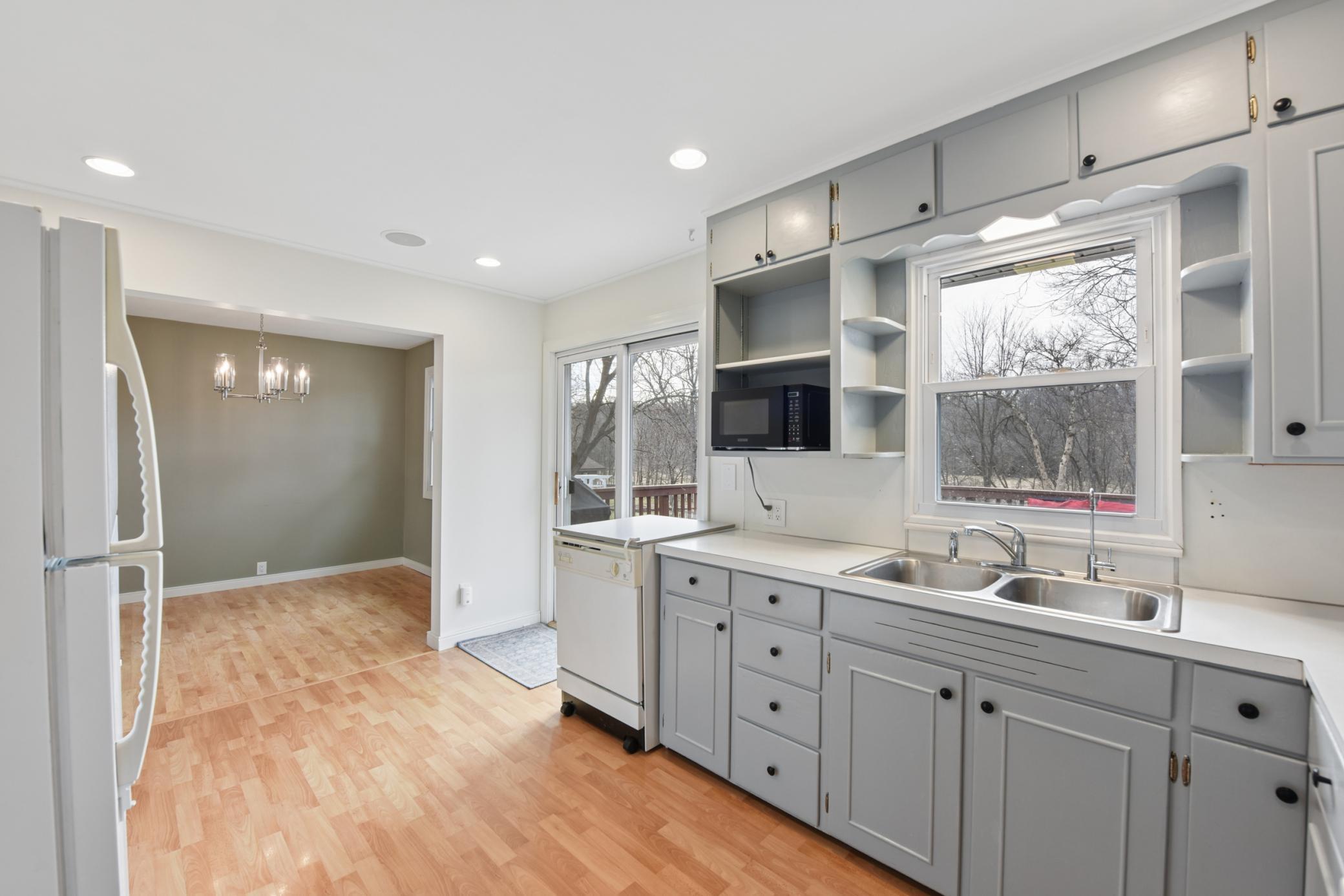 The kitchen offers great natural lighting, ceiling audio and opens into the spacious dining area.