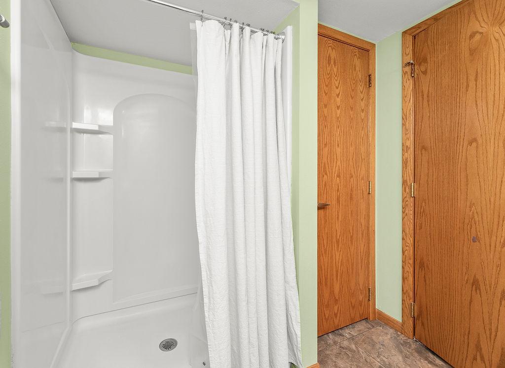 Walk-in shower, linen storage